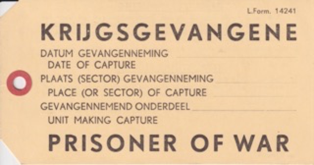 Label Krijgsgevangene / Prisoner of War, met gebruiksaanwijzing op achterzijde